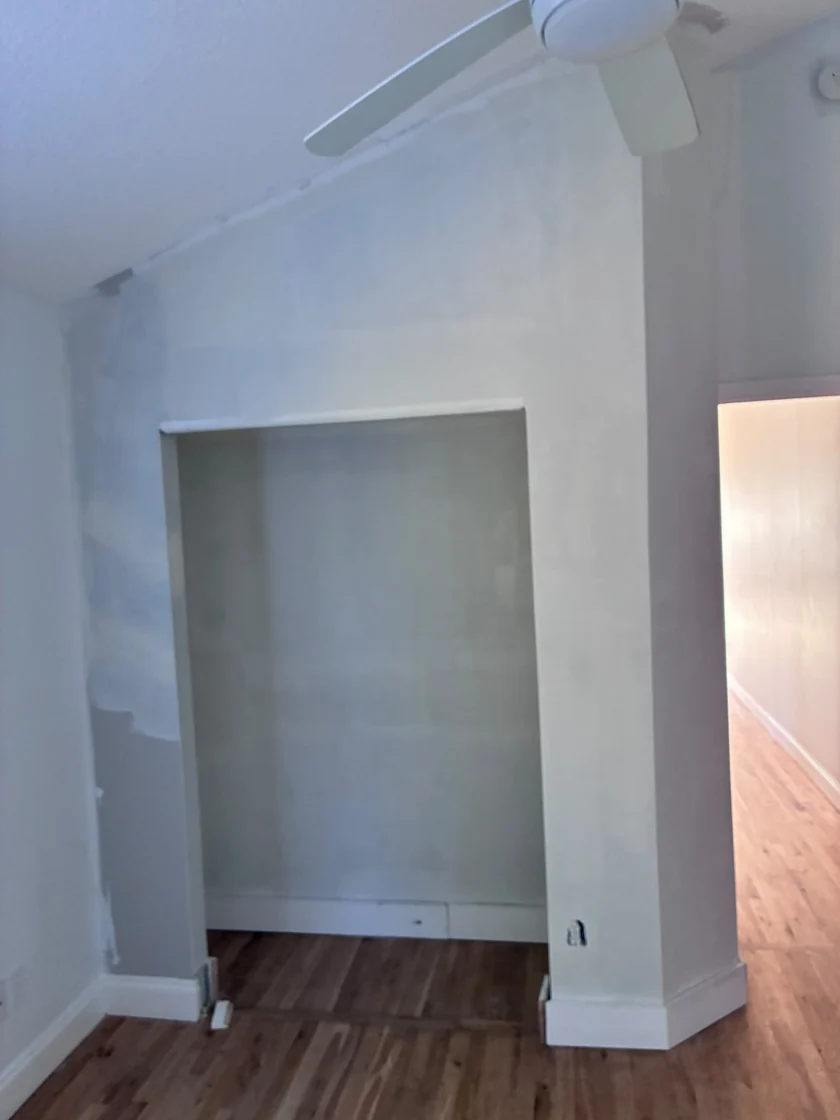 Drywall finishing stage seen from another angle in the same St. Augustine interior